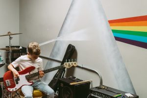 Child learning bass