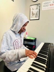 David Hebert-Banwo learning piano in Edmonton