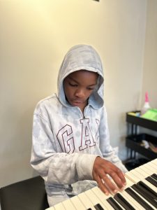 David Herbert-Banwo learning piano in Edmonton