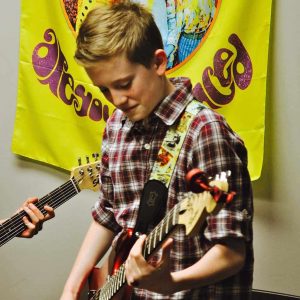 Wren taking guitar lessons in Edmonton