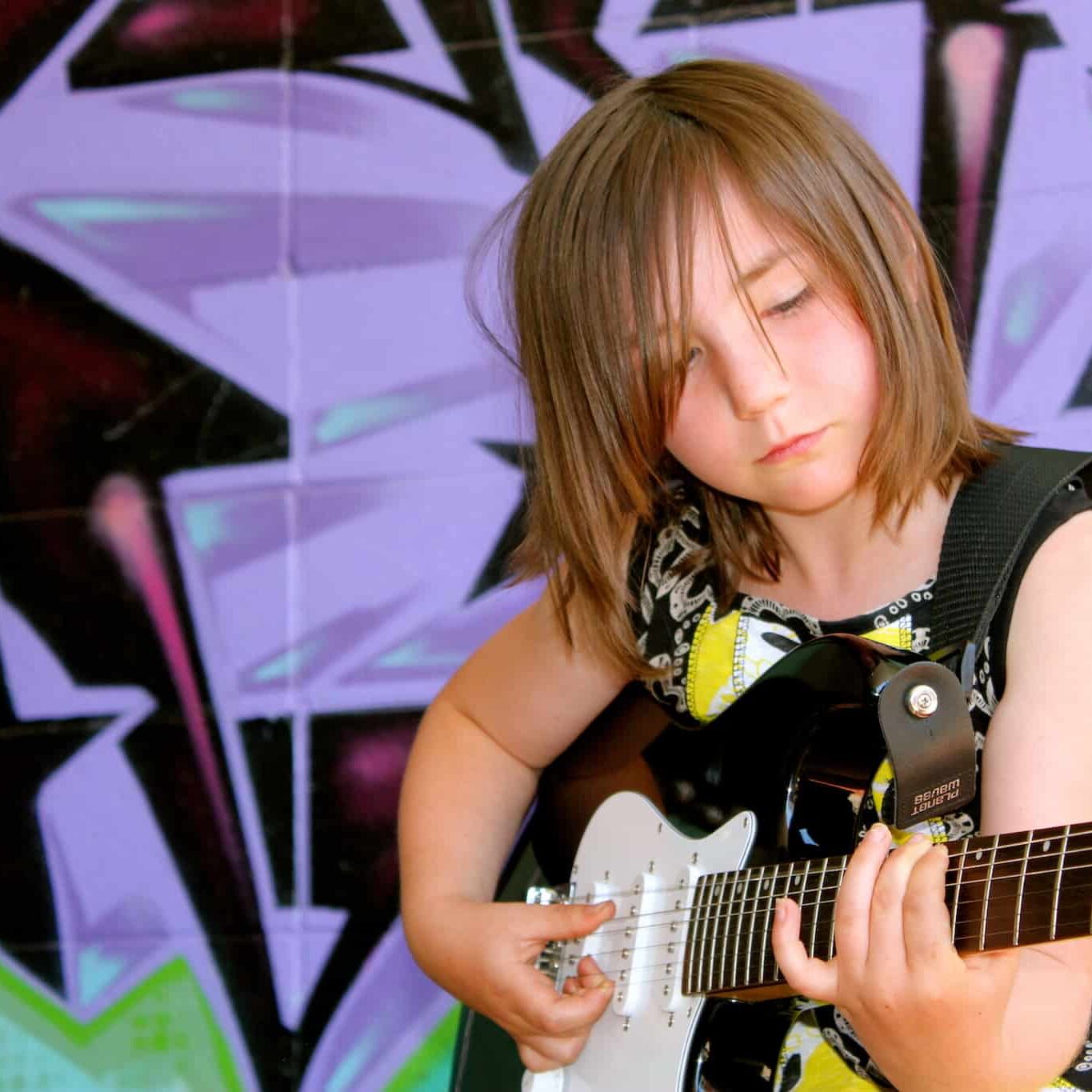 Mallory taking guitar lessons in Edmonton Mallory taking guitar lessons in Edmonton